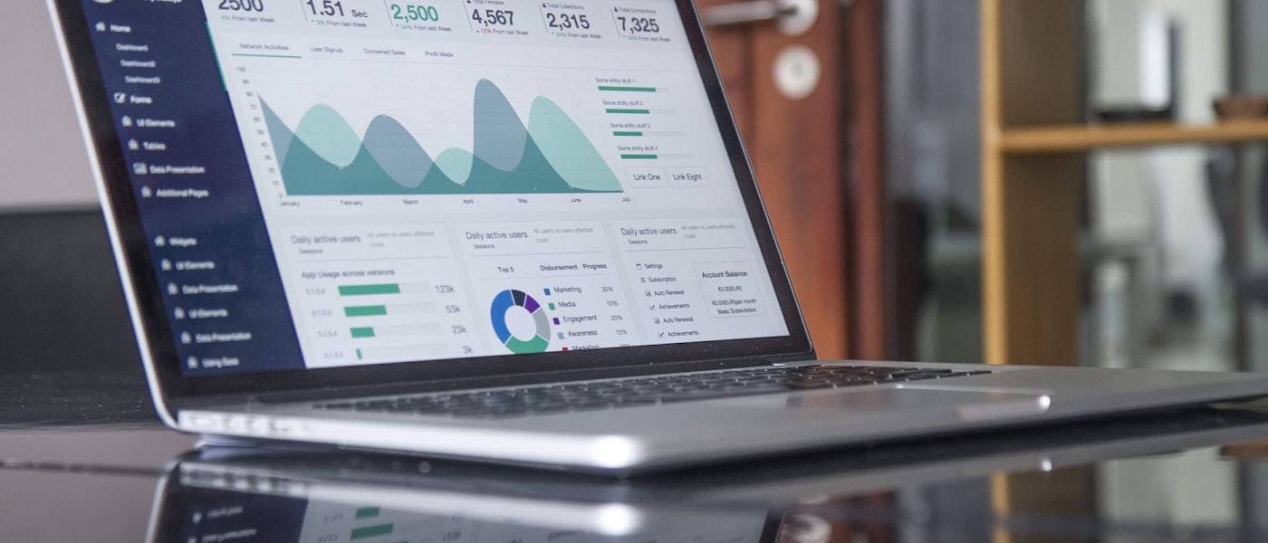 Digital analytics and interface design workspace on a laptop